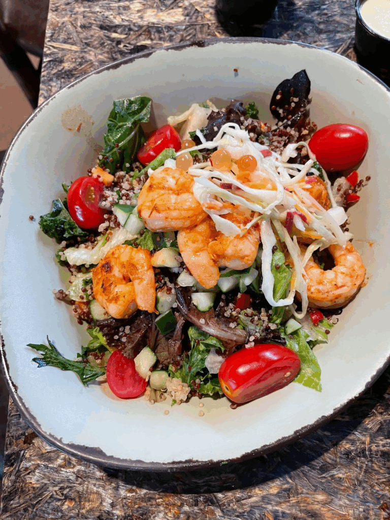 The Chili-Garlic Shrimp Bowl over Hearty Salad with Creamy Herb Dressing on the side. $15.79